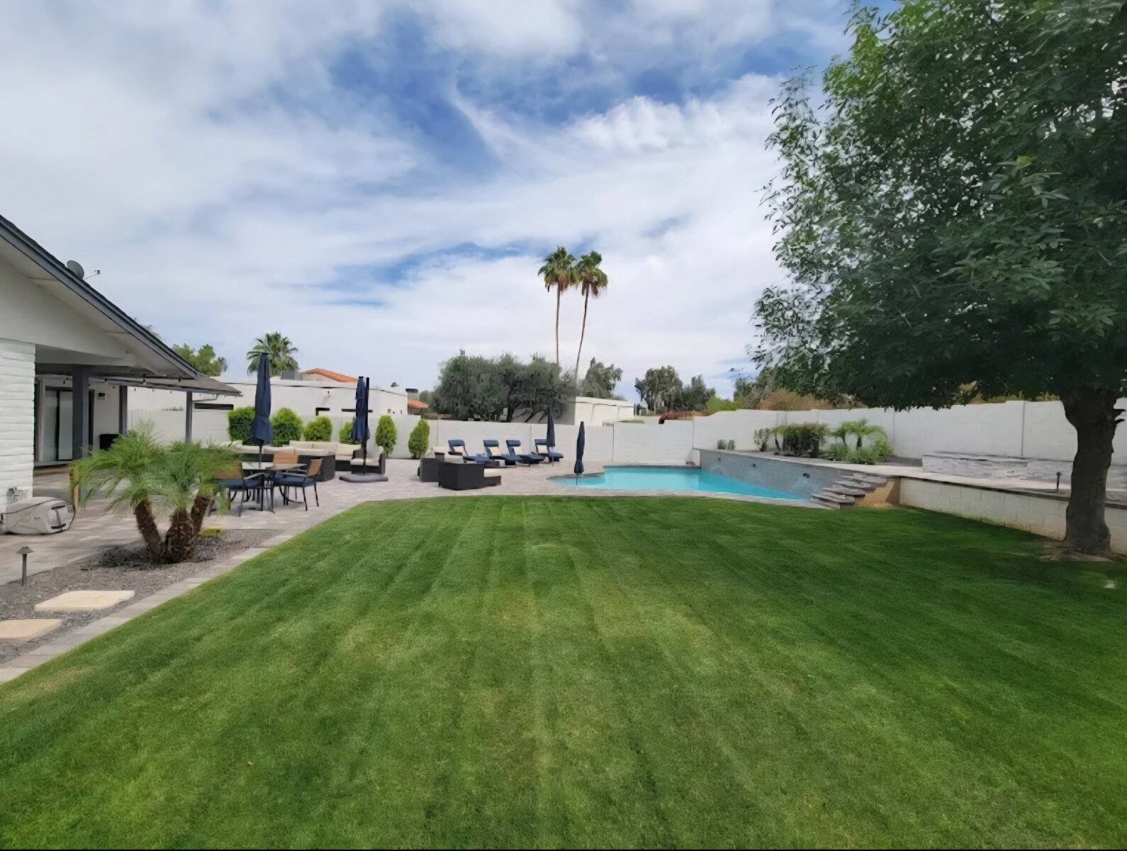 A pristine, professionally maintained lawn by C & A Landscapes